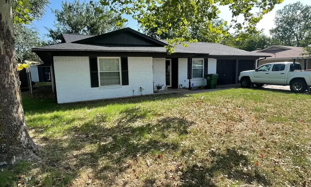 Professional roofing crew working on a residential roof in Elwood